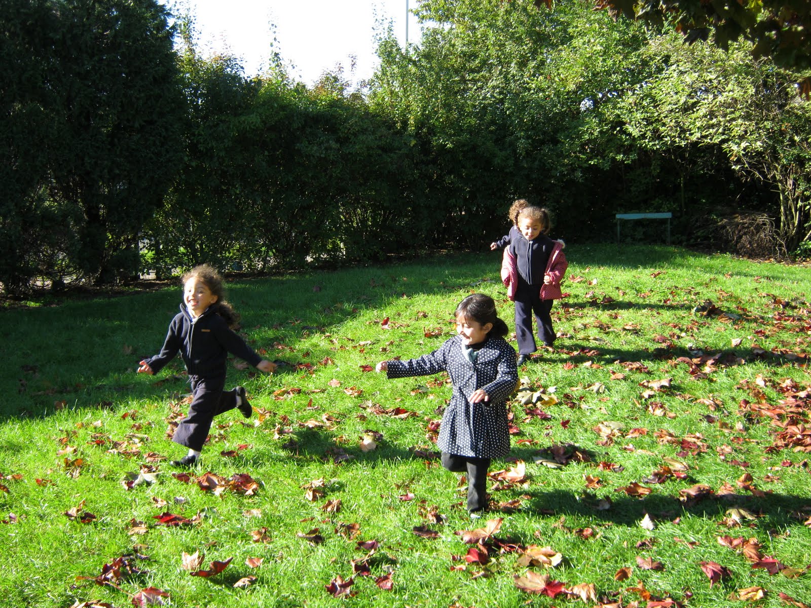 Children Playing Outside In A Nursery