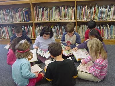 Children Reading Books In Library